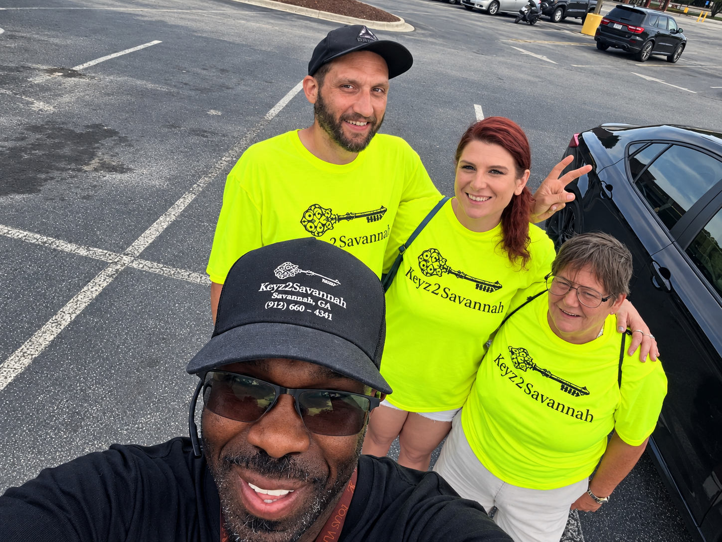 The Keyz2Savannah team wearing branded work shirts
